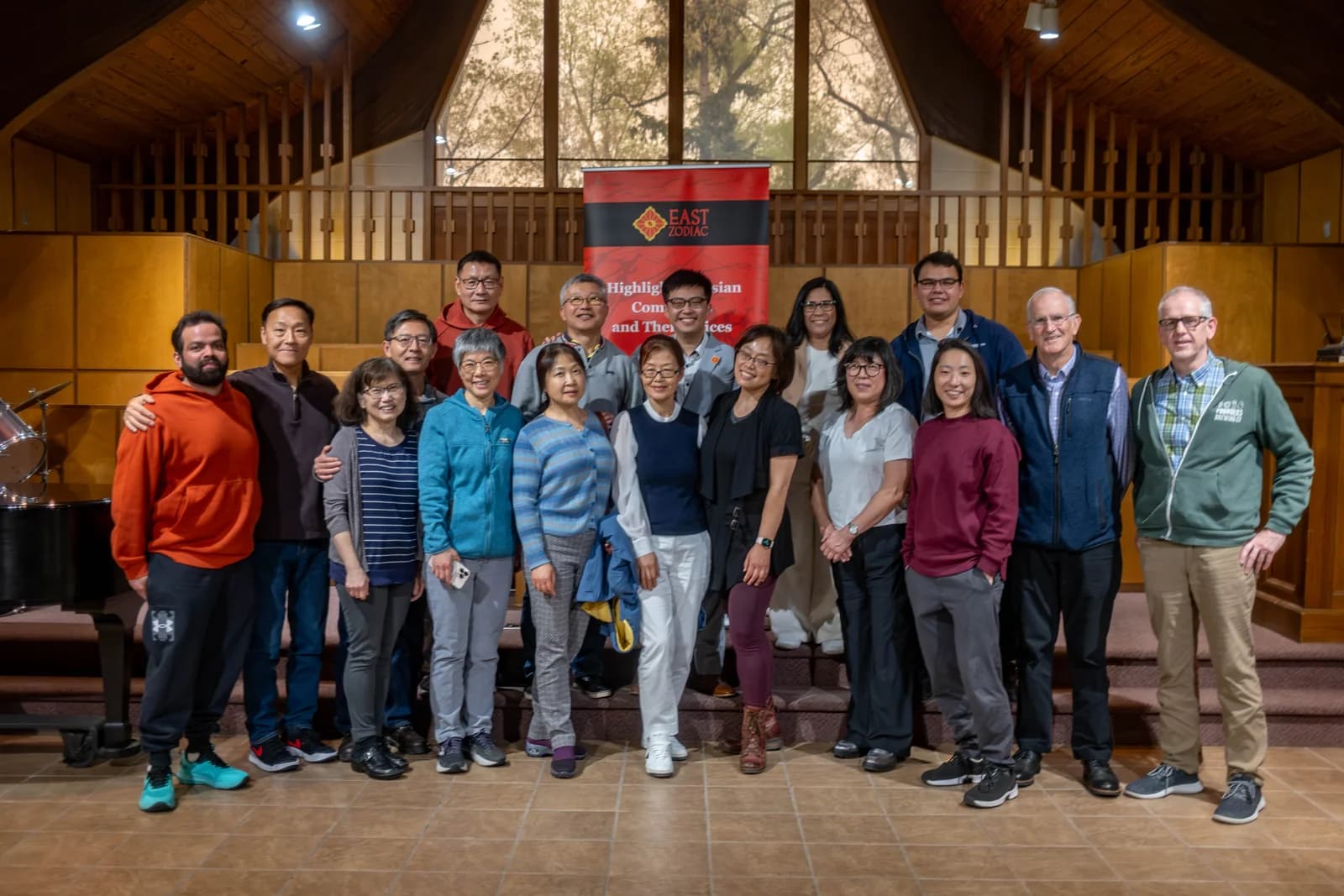 Community members and musicians after an East Zodiac concert
